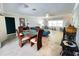 Open living space with tile floors, ceiling fan, and dining area at 931 Juno Dr, Punta Gorda, FL 33950