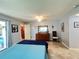 Comfortable main bedroom featuring tile floor and ceiling fan at 931 Juno Dr, Punta Gorda, FL 33950