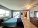 Main bedroom featuring ensuite bathroom, sliding glass doors, and access to kitchen at 931 Juno Dr, Punta Gorda, FL 33950