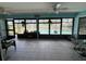 Enclosed patio with tile flooring and outdoor view, offering a tranquil space at 931 Juno Dr, Punta Gorda, FL 33950