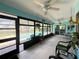 Screened patio offers outdoor seating and clear views of the inviting swimming pool at 931 Juno Dr, Punta Gorda, FL 33950