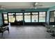 Large screened patio overlooking pool, with views of sunny yard and lush plants at 931 Juno Dr, Punta Gorda, FL 33950