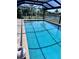 Capture of the sparkling, enclosed pool with clear, blue water at 931 Juno Dr, Punta Gorda, FL 33950