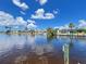 Stunning waterfront view showcasing the canal and the neighborhood's beautiful homes at 931 Juno Dr, Punta Gorda, FL 33950