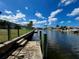 Backyard with waterfront views, a private dock, and the perfect place to relax, fish, and enjoy the peacefulness at 931 Juno Dr, Punta Gorda, FL 33950