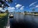 Scenic canal view from the backyard, showcasing waterfront living at its finest at 931 Juno Dr, Punta Gorda, FL 33950
