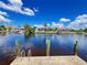 Lovely waterfront homes lining the canal, showcasing docks, landscaping, and serene water views on a sunny day at 931 Juno Dr, Punta Gorda, FL 33950