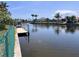 Peaceful waterfront view from the backyard, offering a serene and relaxing setting at 931 Juno Dr, Punta Gorda, FL 33950