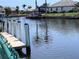 Waterfront view highlighting the backyard dock and waterway access for boating and recreation at 931 Juno Dr, Punta Gorda, FL 33950
