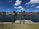 Backyard waterfront featuring a private dock and access to the canal for boating and recreation at 931 Juno Dr, Punta Gorda, FL 33950