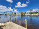 Waterfront property view, featuring a concrete dock and beautiful views of the waterway at 931 Juno Dr, Punta Gorda, FL 33950