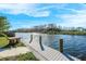 A picturesque wooden dock by the tranquil canal, inviting serene waterfront moments at 1020 Drury Ln, Englewood, FL 34224