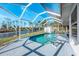 A serene outdoor pool with views of the canal, ideal for waterfront relaxation and enjoyment at 1020 Drury Ln, Englewood, FL 34224