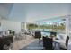 Enclosed patio with an outdoor pool overlooking the serene canal, perfect for relaxation and entertaining at 1020 Drury Ln, Englewood, FL 34224