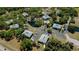 An aerial view of the condos, pools, lakes, parking lots, tennis court, and landscaping at 1051 Forrest Nelson Blvd # 104, Port Charlotte, FL 33952