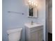 Modern bathroom featuring a sink, a mirror, and a toilet with stylish fixtures at 1051 Forrest Nelson Blvd # 104, Port Charlotte, FL 33952