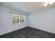 Sun-filled bedroom with new flooring, fresh paint and a view to the outdoors at 1051 Forrest Nelson Blvd # 104, Port Charlotte, FL 33952