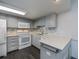 Updated kitchen boasts modern appliances, sleek countertops, stylish backsplash, and painted cabinets at 1051 Forrest Nelson Blvd # 104, Port Charlotte, FL 33952