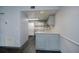 Well-lit kitchen featuring gray cabinets, modern appliances, and a stylish backsplash at 1051 Forrest Nelson Blvd # 104, Port Charlotte, FL 33952