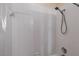 Bright bathroom featuring a shower with white tiles and a showerhead at 1085 Jonah Dr, North Port, FL 34289