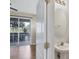 Bathroom with a sink, mirror, and sliding glass doors leading to the patio at 1085 Jonah Dr, North Port, FL 34289