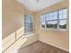 Bedroom with neutral carpet, window with view, and natural light at 1085 Jonah Dr, North Port, FL 34289