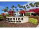 Welcome to Lakeside Plantation with its beautiful fountain and palm trees at 1085 Jonah Dr, North Port, FL 34289