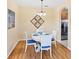 Cozy dining area featuring a round table with seating for four and modern light fixture at 1085 Jonah Dr, North Port, FL 34289