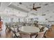 Bright event space with hardwood floors, ample seating, and ceiling fans at 1085 Jonah Dr, North Port, FL 34289
