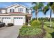 Inviting two-story home with well-manicured landscaping and attached two-car garage at 1085 Jonah Dr, North Port, FL 34289