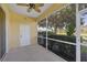 Screened lanai with ceiling fan and peaceful view at 1085 Jonah Dr, North Port, FL 34289