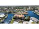 Stunning aerial view of a condo building, lush landscaping, and pristine waterfront property, offering a serene retreat at 1326 Wesley Dr # 123, Punta Gorda, FL 33950