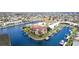 Aerial view of a waterfront property with a beautiful condo building surrounded by lush landscaping and private boat docks at 1326 Wesley Dr # 123, Punta Gorda, FL 33950
