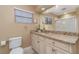 Inviting bathroom featuring granite counters, a sink, toilet, and shower at 1326 Wesley Dr # 123, Punta Gorda, FL 33950