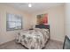 Charming bedroom with a ceiling fan, large window, and a comfortable bed at 1326 Wesley Dr # 123, Punta Gorda, FL 33950