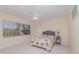 Bright bedroom with a ceiling fan, a large window, and comfortable furnishings at 1326 Wesley Dr # 123, Punta Gorda, FL 33950