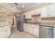 Well-lit kitchen showcasing granite countertops, modern stainless steel appliances, and sleek cabinetry at 1326 Wesley Dr # 123, Punta Gorda, FL 33950