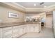 Open kitchen featuring granite countertops, a breakfast bar, and ample cabinetry for storage at 1326 Wesley Dr # 123, Punta Gorda, FL 33950