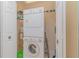 Convenient laundry area featuring a stacked washer and dryer at 1326 Wesley Dr # 123, Punta Gorda, FL 33950