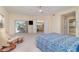 Tranquil main bedroom boasts private balcony access and an adjacent en-suite bathroom and living room at 1326 Wesley Dr # 123, Punta Gorda, FL 33950