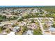 A quiet residential neighborhood near the ocean featuring tree-lined streets and a variety of single-Gathering homes at 1357 Le Pera Rd, Englewood, FL 34223