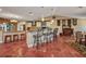 Open-concept living space with dining area and kitchen featuring a breakfast bar at 1357 Le Pera Rd, Englewood, FL 34223