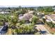 Beautiful single-story home with lush tropical landscaping, a screened lanai, and a long driveway at 1357 Le Pera Rd, Englewood, FL 34223