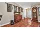 Foyer with tiled floors, grandfather clock, and vintage decor at 1357 Le Pera Rd, Englewood, FL 34223