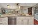 Kitchen with granite countertops, stainless steel appliances, terracotta tile floors, and a stainless steel dishwasher at 1357 Le Pera Rd, Englewood, FL 34223