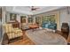 Open living room with wood floors, stylish furniture, and sliding glass doors to the backyard at 1357 Le Pera Rd, Englewood, FL 34223
