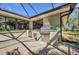 Outdoor grill and food prep area sits adjacent to the enclosed brick pool patio at 1357 Le Pera Rd, Englewood, FL 34223