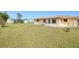 Large backyard featuring chain link fence, an outbuilding and plenty of room for outdoor activities at 167 N Cambridge Nw Dr, Port Charlotte, FL 33952