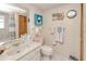 Bright bathroom featuring decorative accents, ample towel storage, and a neutral color scheme at 167 N Cambridge Nw Dr, Port Charlotte, FL 33952