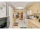 Inviting kitchen featuring bright white tile floors, lots of cabinets, and stainless steel appliances at 167 N Cambridge Nw Dr, Port Charlotte, FL 33952